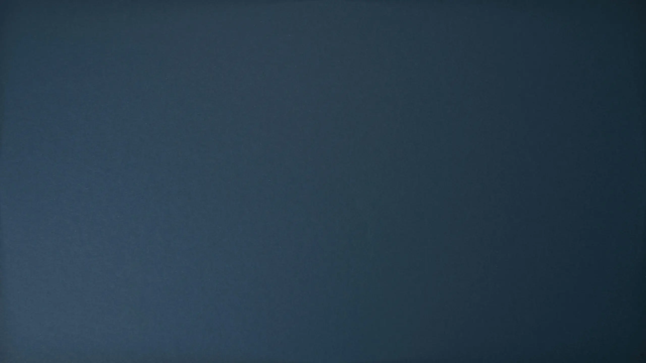 Dark blue textured background perfect for design projects and wallpapers.